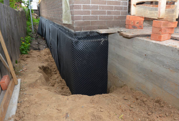 SJ Waterproofing Pros technician performing targeted Exterior Waterproofing assessment in Camp Hill, AL